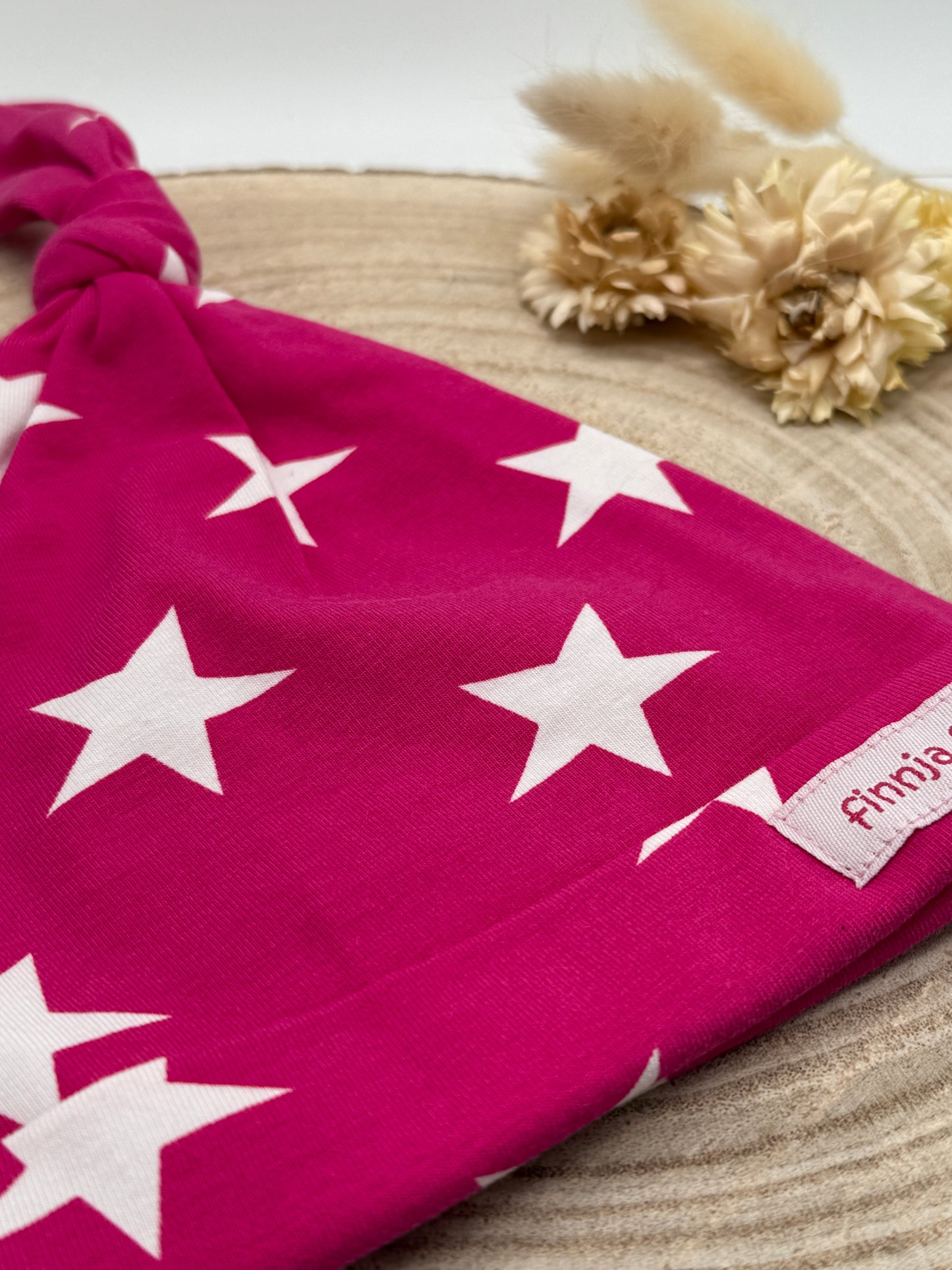 Babymütze mit Knoten – rosa mit Stern Motive