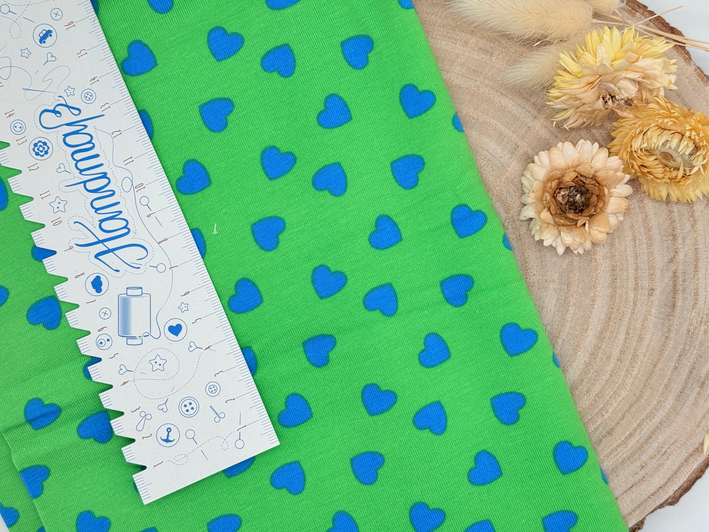 Jersey Reststück blaue Herzen auf Grün